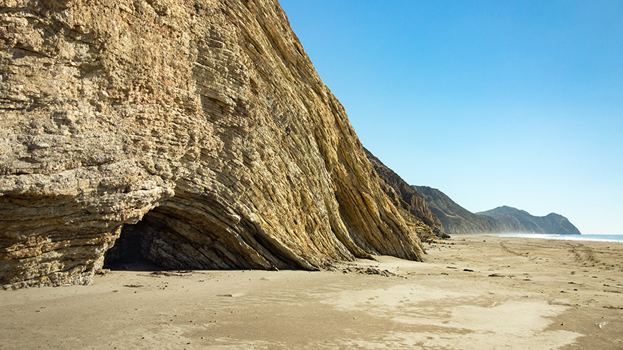 arched cliff formation on beach