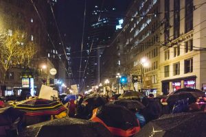 san francisco protesters marching in the rain