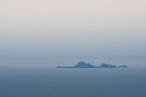 a small group of isolated islands in the far distance
